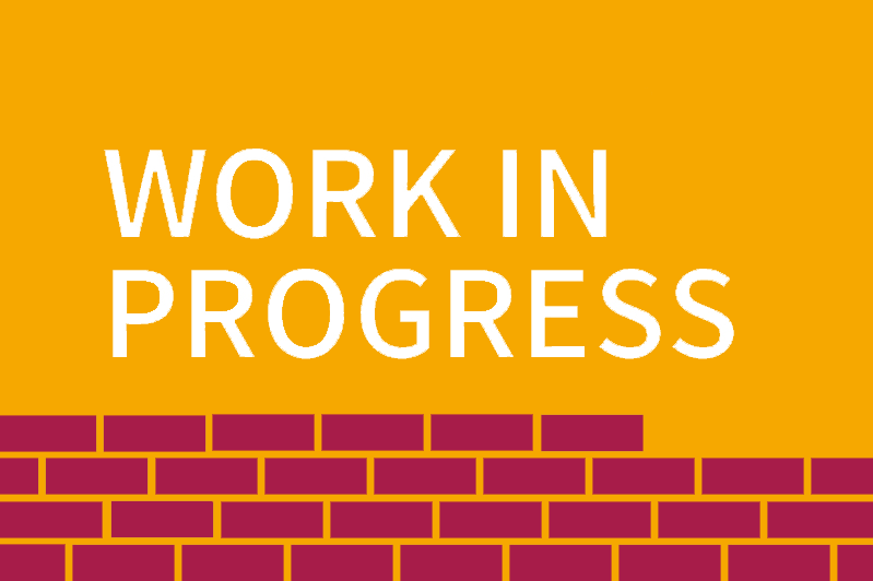 a red brick wall and the text 'Work in progress'